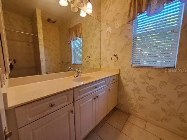 a bathroom with a sink and a washing machine