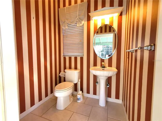 a bathroom with a sink and a washing machine