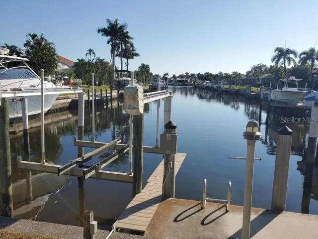 a view of a wooden deck with a lake