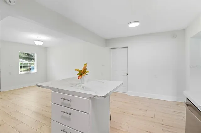 a kitchen with sink and cabinets