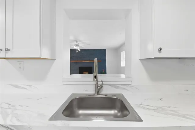 a bathroom with a stove and a sink