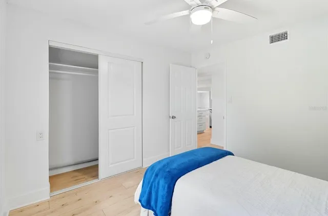 en empty room with windows and entrance