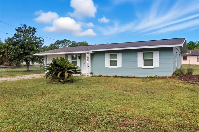 a view of a house with a big yard