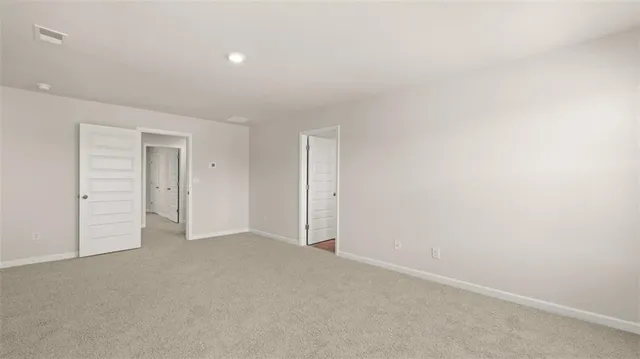 an empty room with closet area