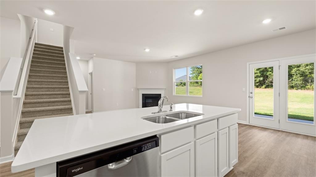 1898 Roxey Lane Winder, GA 30680 - Photo 9 of 21 a kitchen with kitchen island a sink appliances and a large window