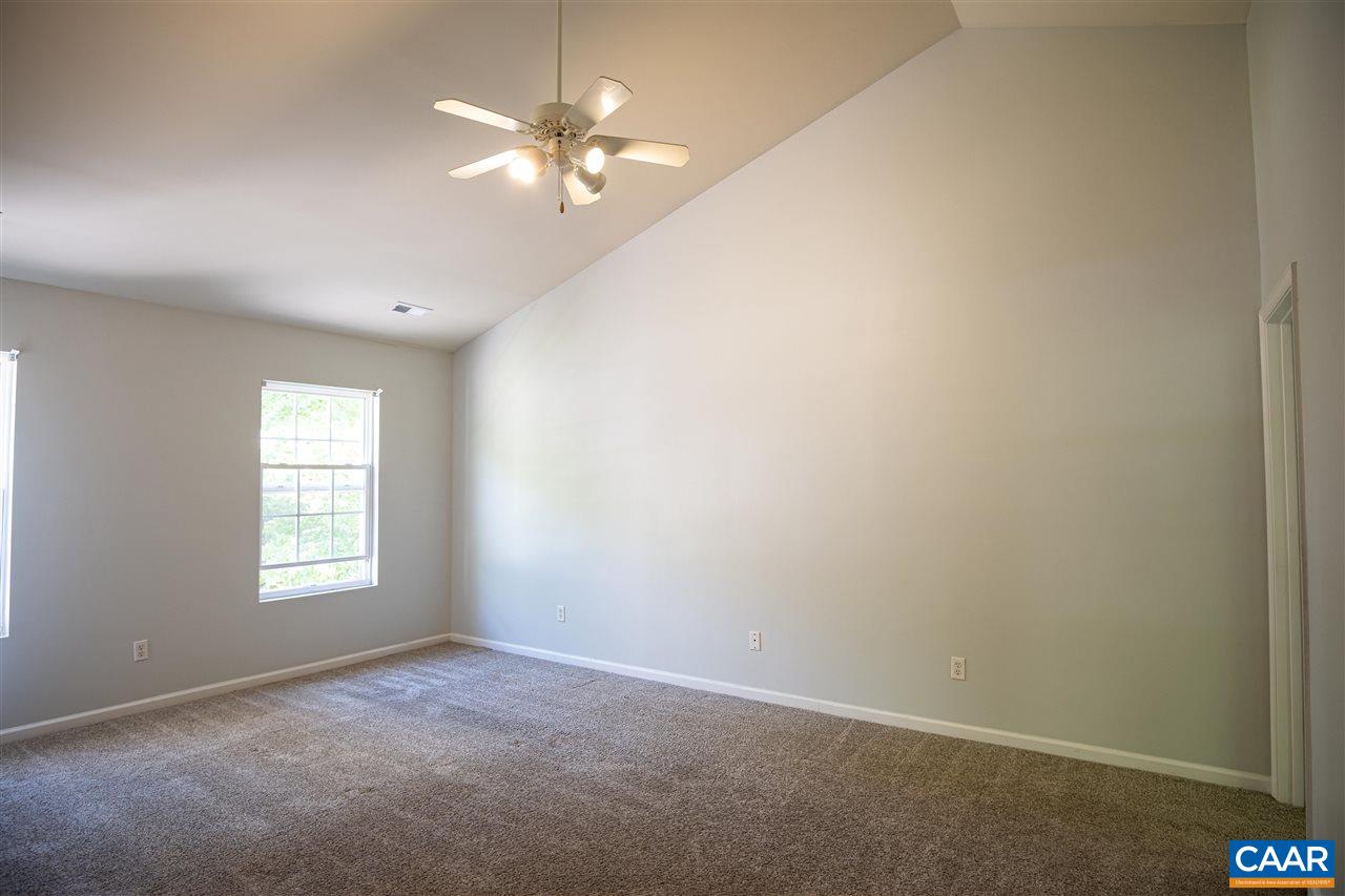 29 Zephyr Road Palmyra, VA 22963 - Photo 26 of 45 an empty room with windows and chandelier fan