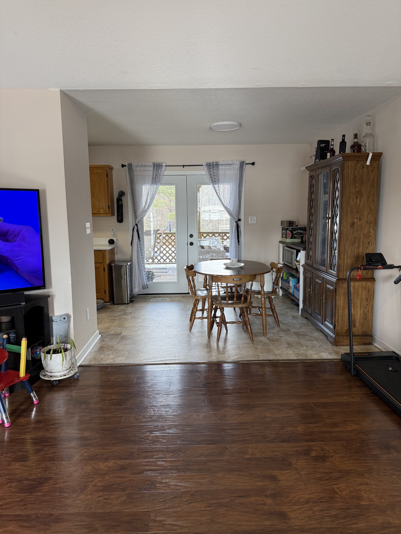 5716 Spring Creek Road Tullahoma, TN 37388 - Photo 3 of 8 a living room with furniture a wooden floor and a flat screen tv