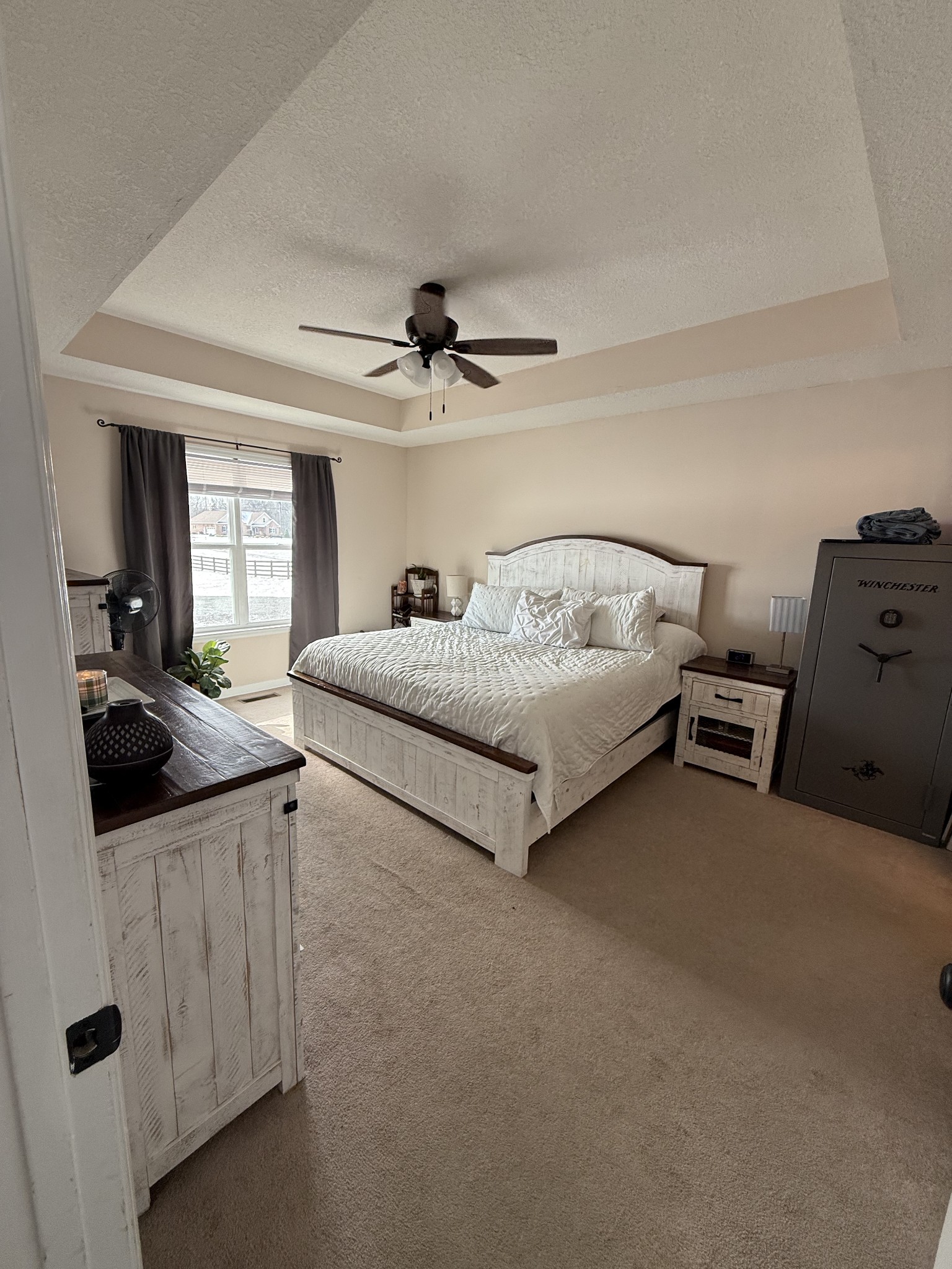 5716 Spring Creek Road Tullahoma, TN 37388 - Photo 5 of 8 a bedroom with a bed and a chandelier