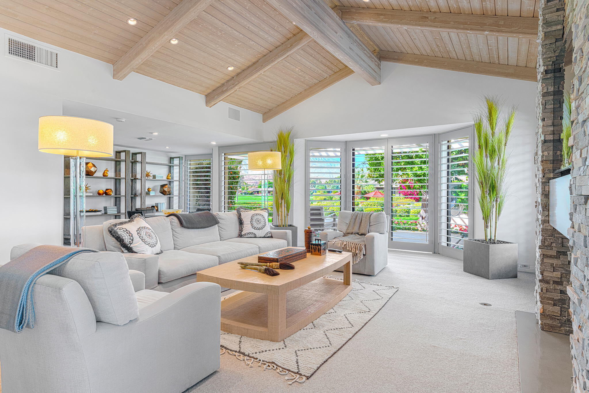 10 Creekside Drive Rancho Mirage, CA 92270 - Photo 12 of 32 a living room with furniture and a large window