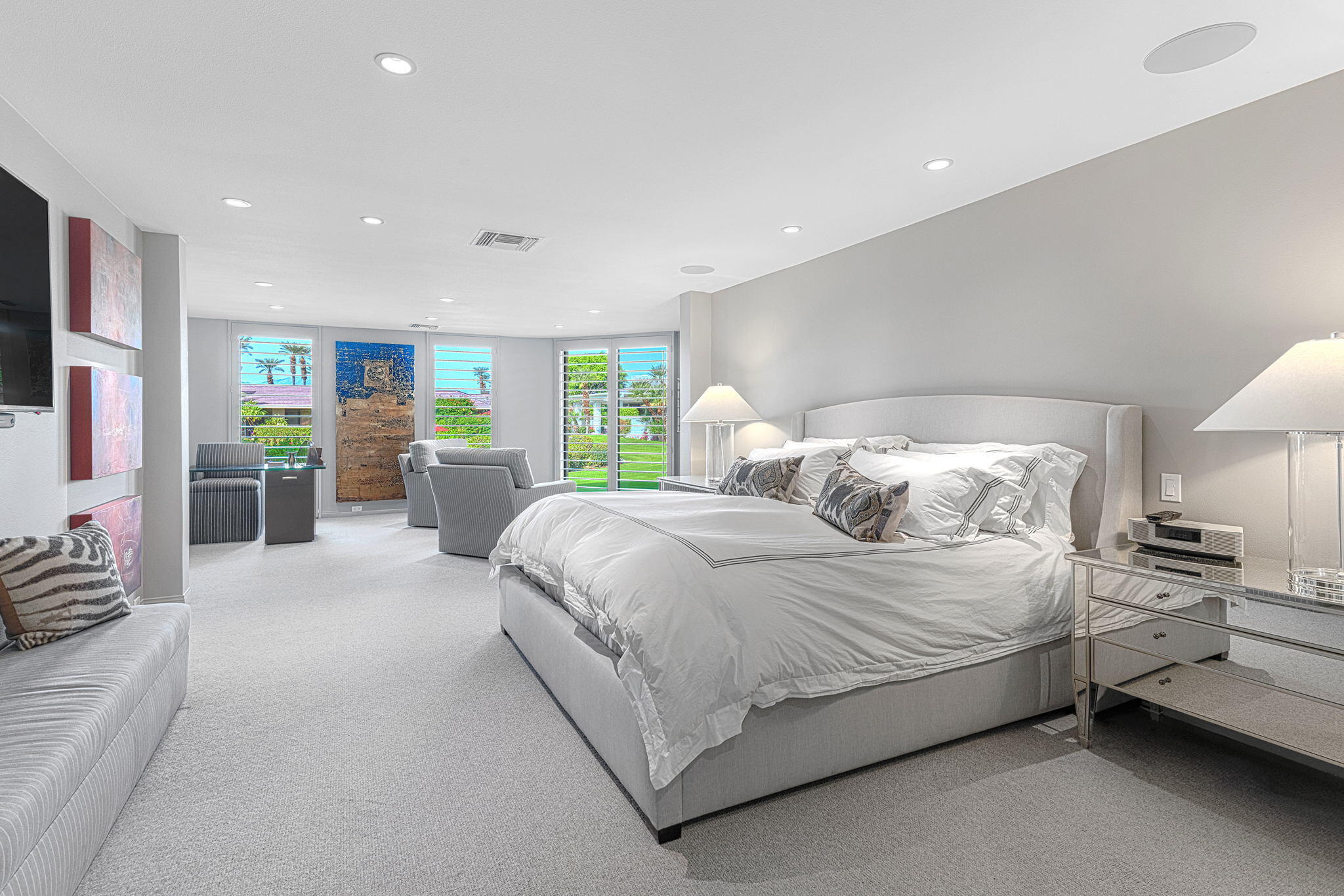 10 Creekside Drive Rancho Mirage, CA 92270 - Photo 22 of 32 a bedroom with a large bed and a couch