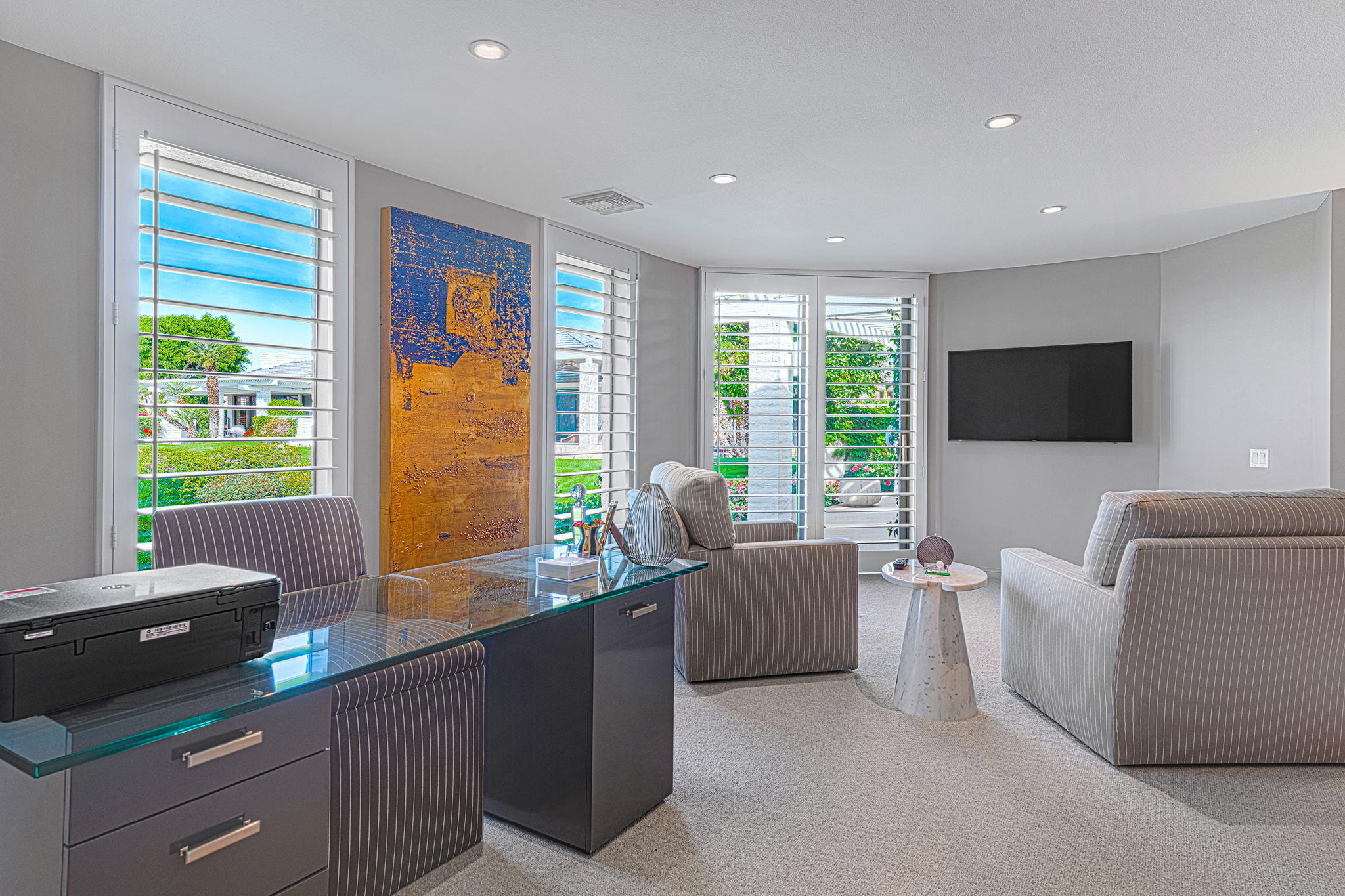 10 Creekside Drive Rancho Mirage, CA 92270 - Photo 23 of 32 a living room with furniture and a flat screen tv