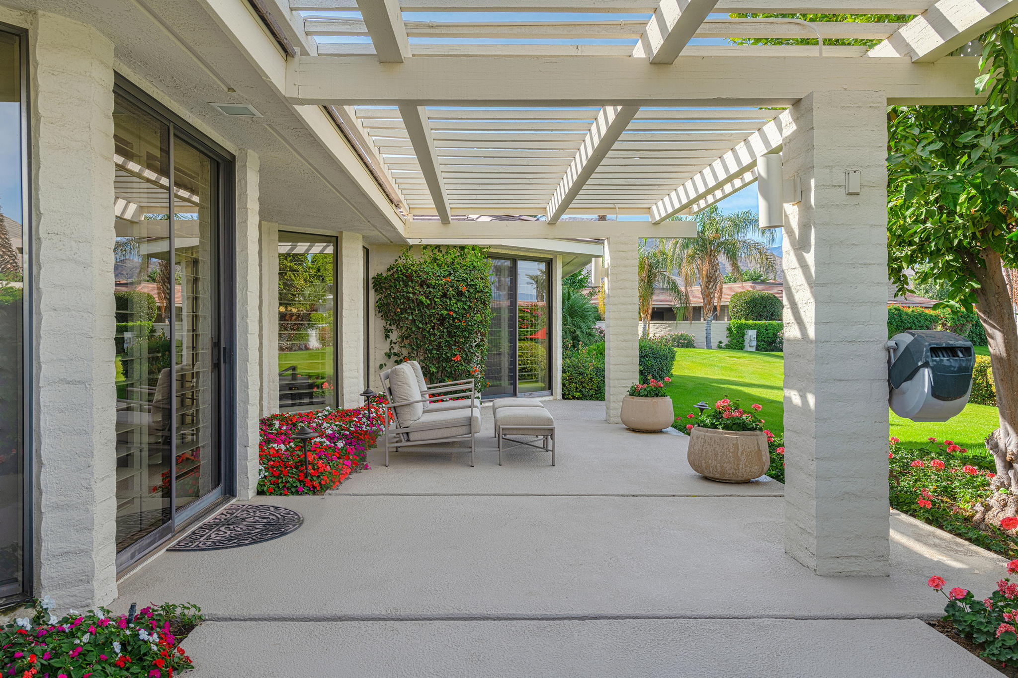 10 Creekside Drive Rancho Mirage, CA 92270 - Photo 24 of 32 a building outdoor space with patio furniture and potted plants