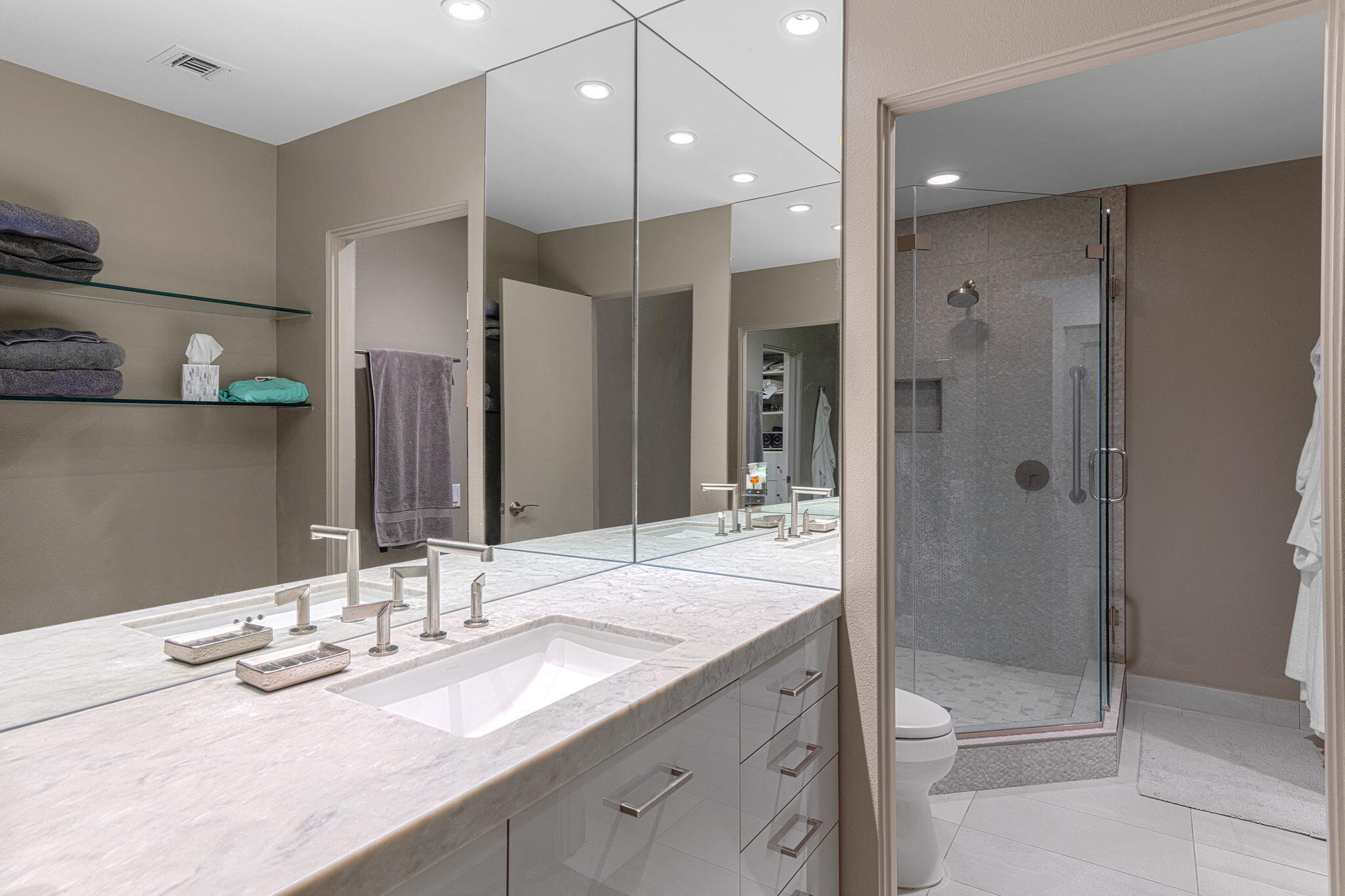 10 Creekside Drive Rancho Mirage, CA 92270 - Photo 27 of 32 a bathroom with a granite countertop sink a toilet and shower