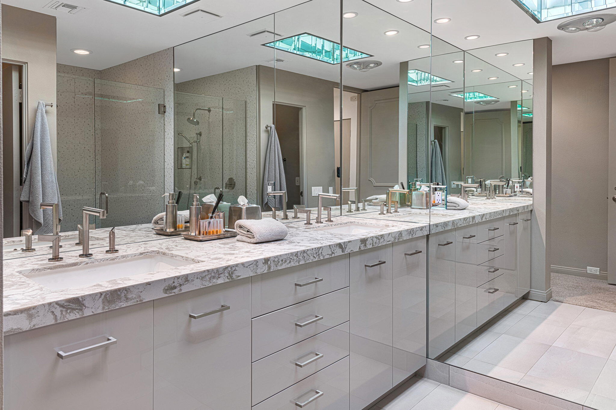 10 Creekside Drive Rancho Mirage, CA 92270 - Photo 31 of 32 a bathroom with a double vanity sink and a mirror