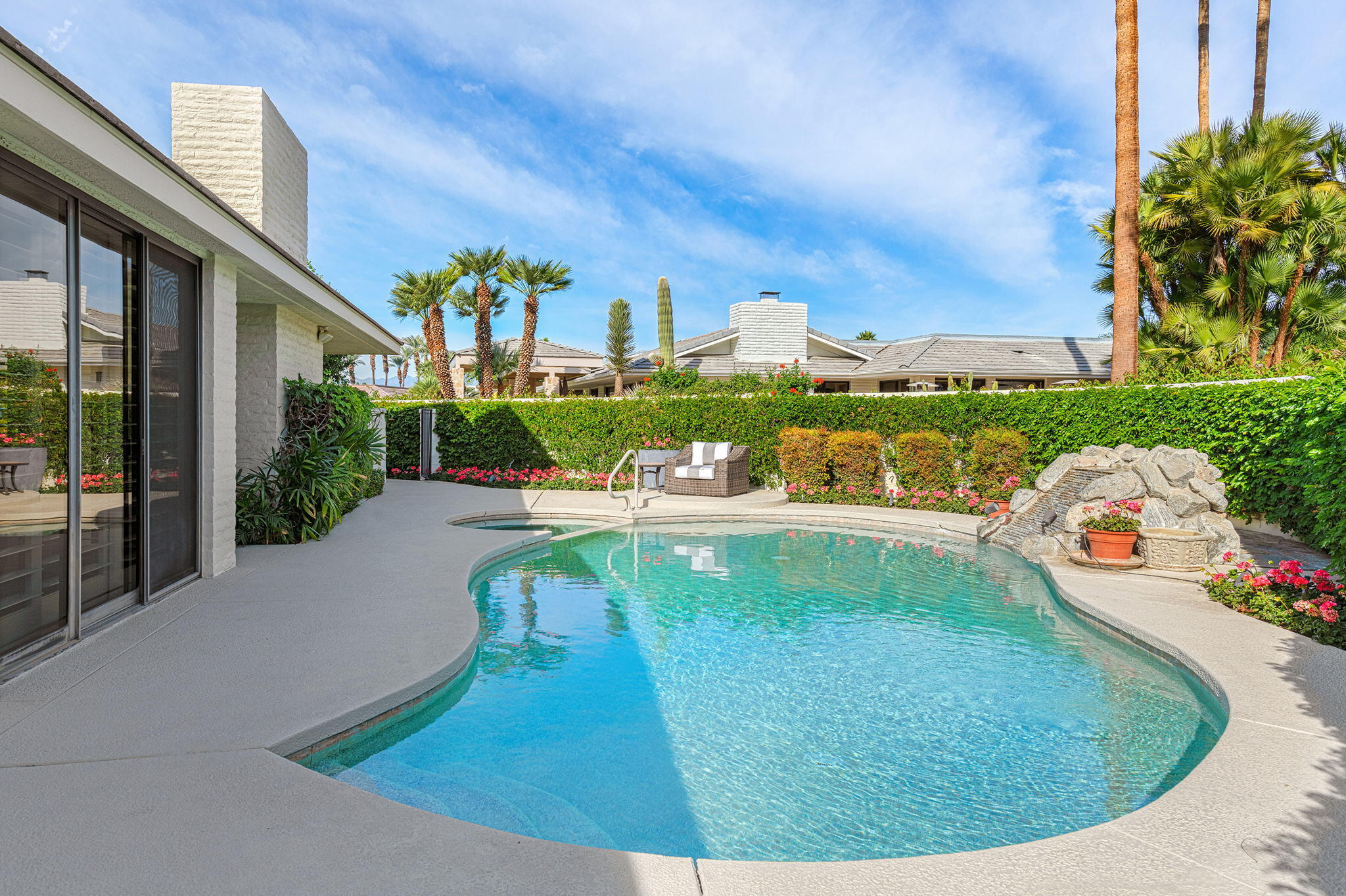 10 Creekside Drive Rancho Mirage, CA 92270 - Photo 4 of 32 a view of a swimming pool from a balcony