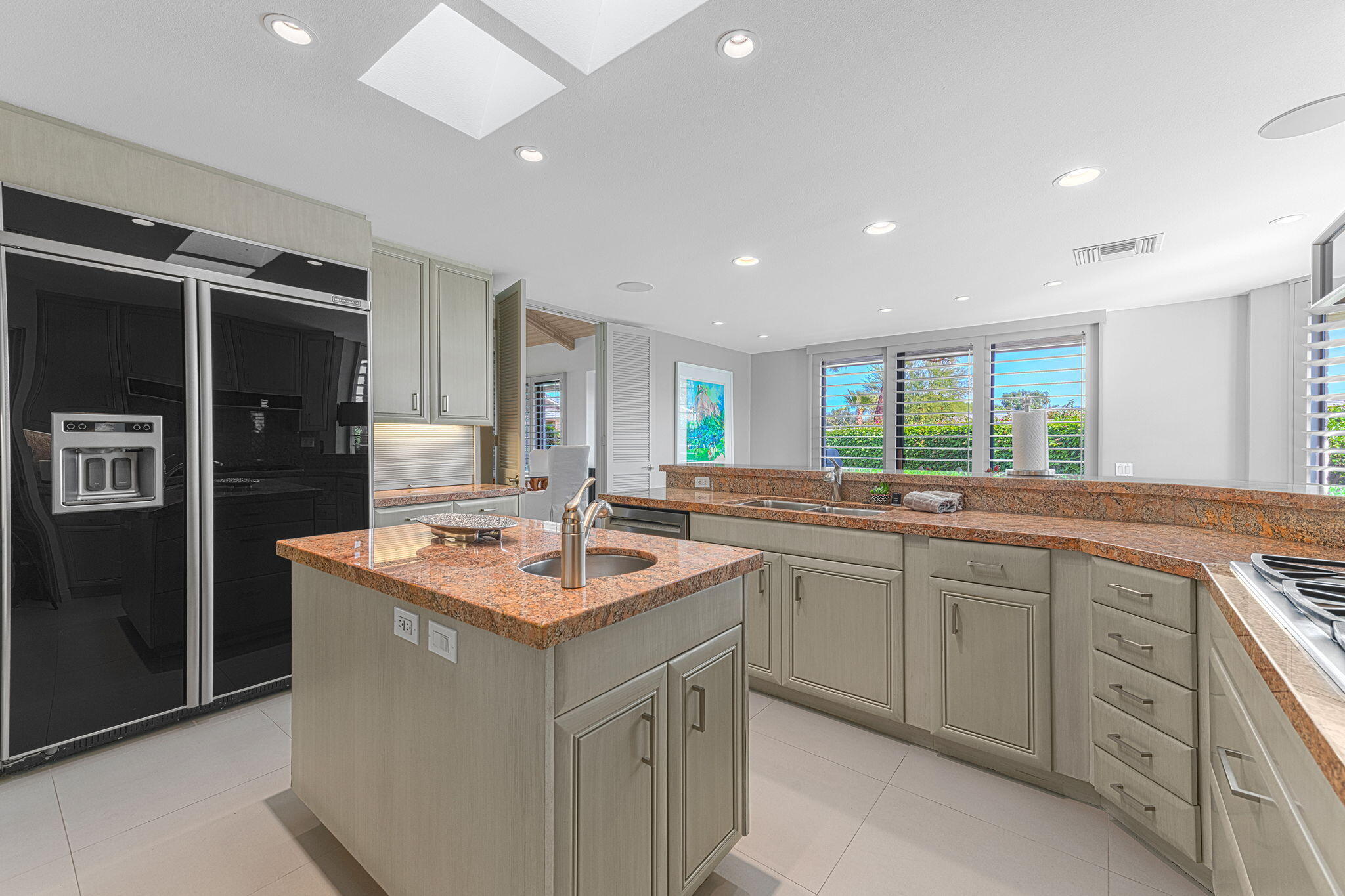 10 Creekside Drive Rancho Mirage, CA 92270 - Photo 6 of 32 a kitchen with sink stove and refrigerator