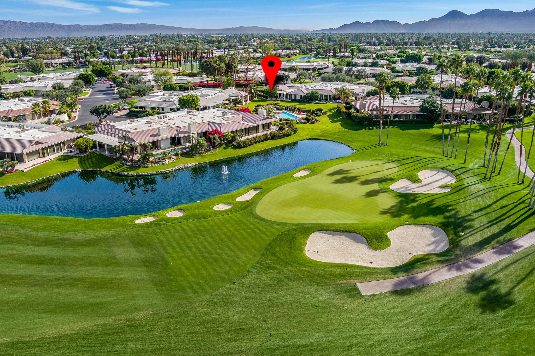 10 Creekside Drive Rancho Mirage, CA 92270 - Photo 9 of 32 a view of a swimming pool with an outdoor space and seating area