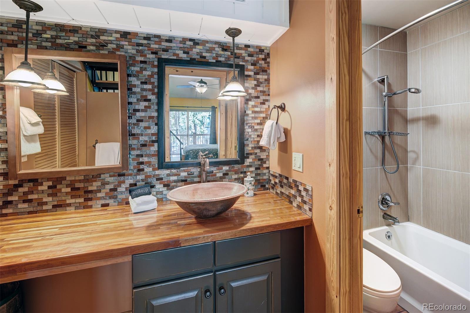 760 Columbine Road, Unit B6 Breckenridge, CO 80424 - Photo 17 of 39 a view of bathroom with a sink and mirror