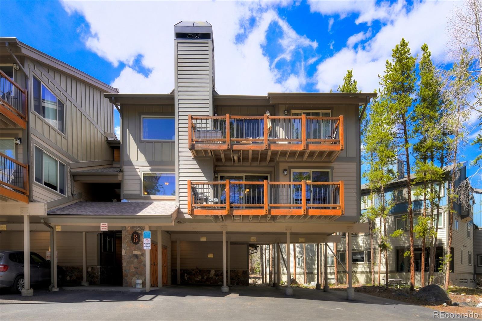 760 Columbine Road, Unit B6 Breckenridge, CO 80424 - Photo 2 of 39 a front view of a building and a street