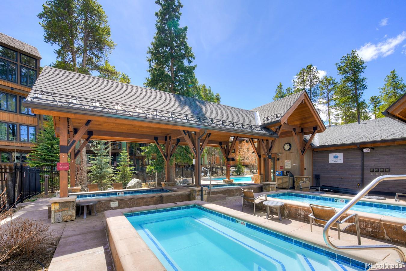 760 Columbine Road, Unit B6 Breckenridge, CO 80424 - Photo 24 of 39 a view of a patio with swimming pool table and chairs
