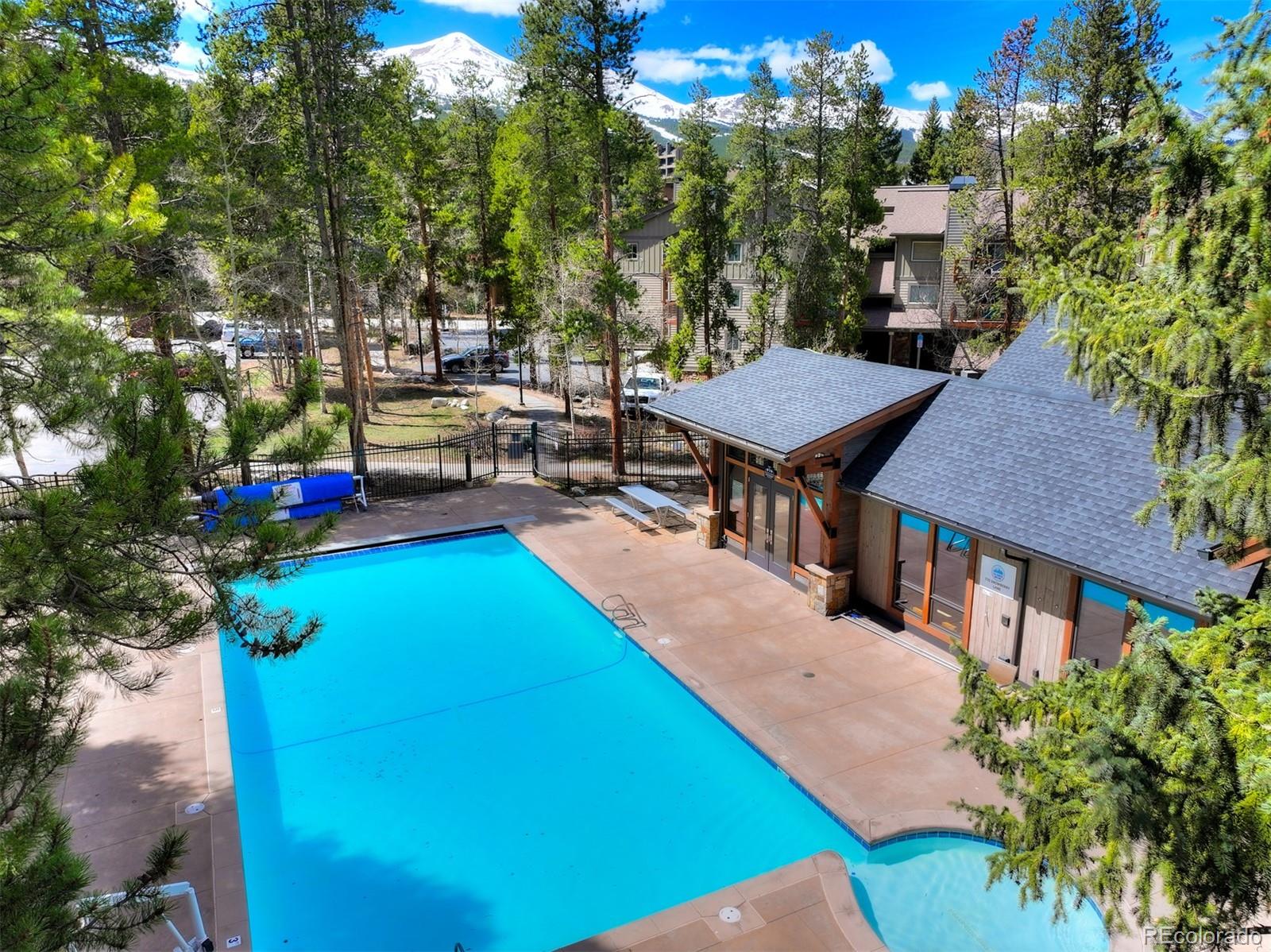760 Columbine Road, Unit B6 Breckenridge, CO 80424 - Photo 26 of 39 a view of a patio with table and chairs and potted plants