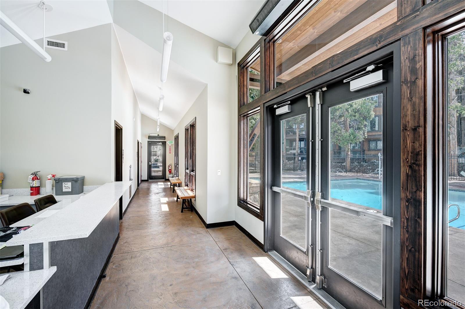 760 Columbine Road, Unit B6 Breckenridge, CO 80424 - Photo 34 of 39 a hallway with a large window and a couch