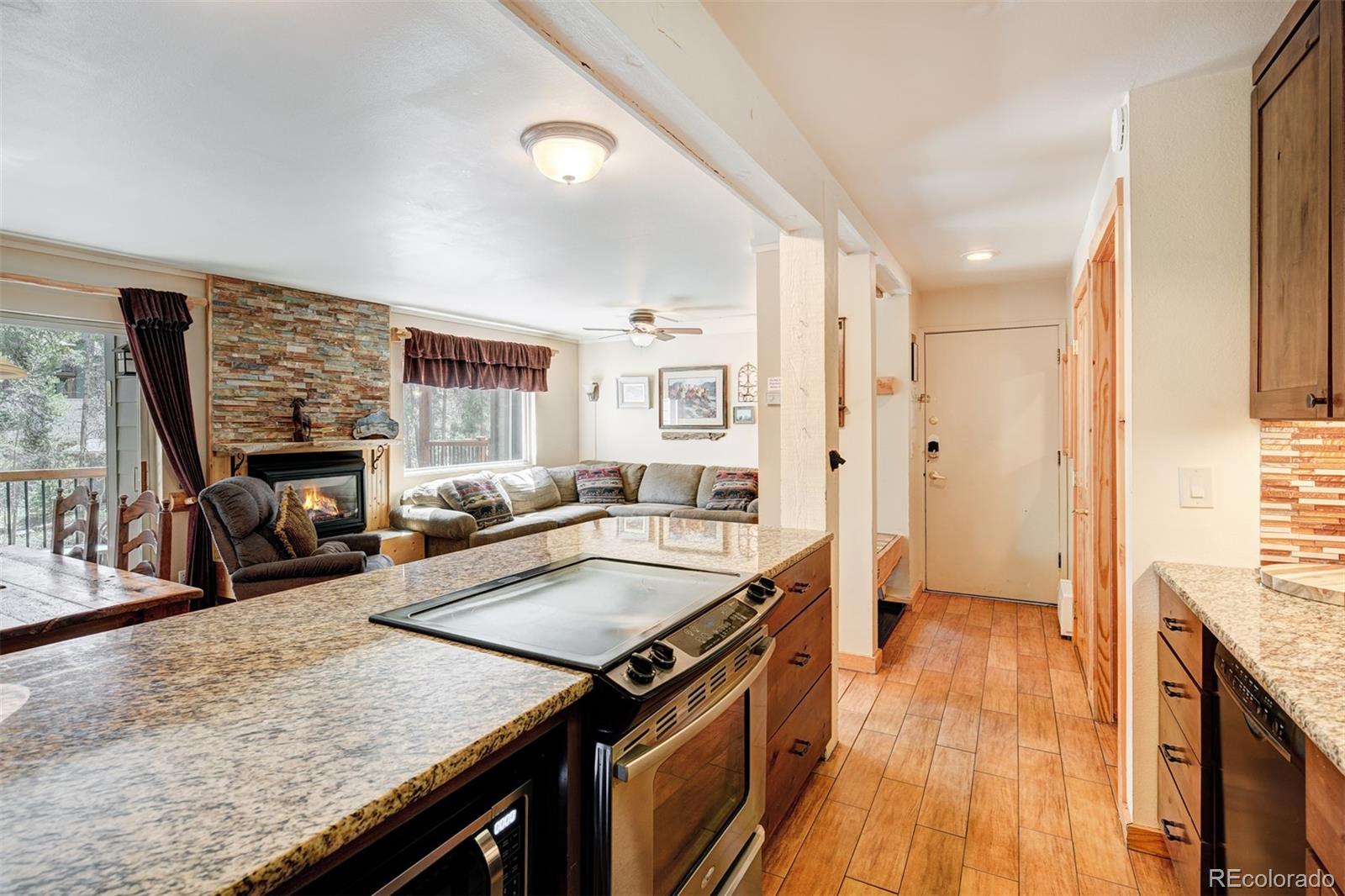 760 Columbine Road, Unit B6 Breckenridge, CO 80424 - Photo 4 of 39 a kitchen with stainless steel appliances granite countertop a sink stove and refrigerator
