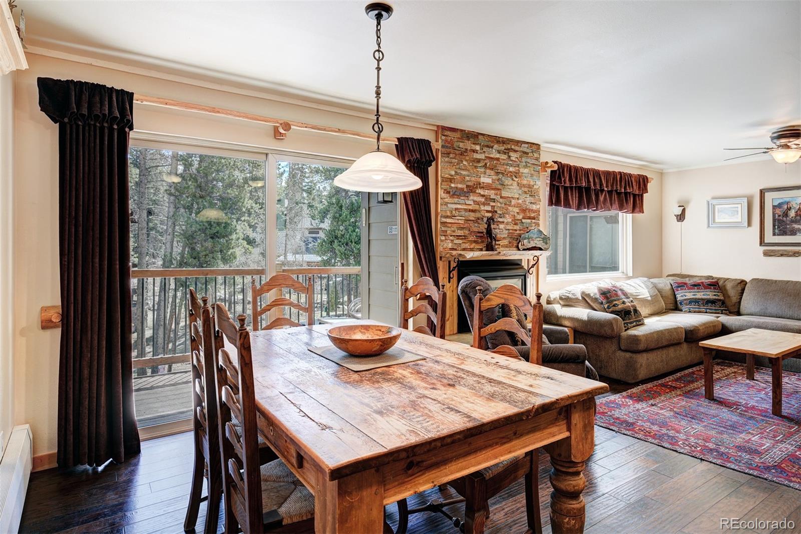 760 Columbine Road, Unit B6 Breckenridge, CO 80424 - Photo 5 of 39 a living room with furniture a table and chairs