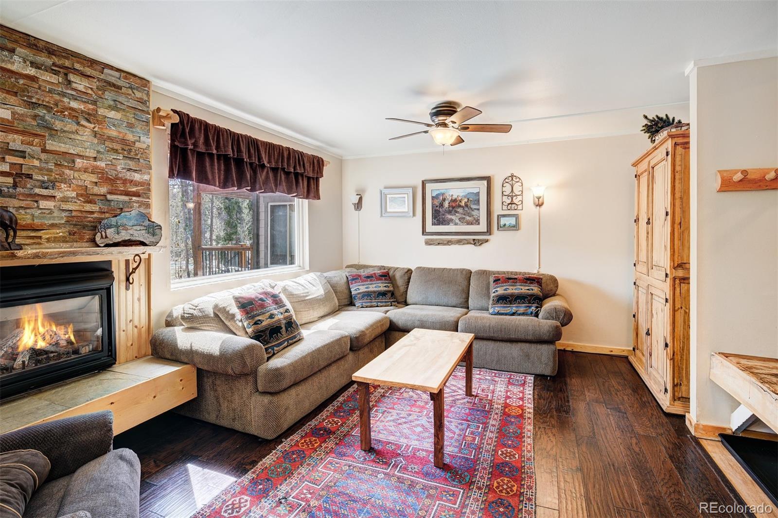760 Columbine Road, Unit B6 Breckenridge, CO 80424 - Photo 7 of 39 a living room with furniture and a fireplace