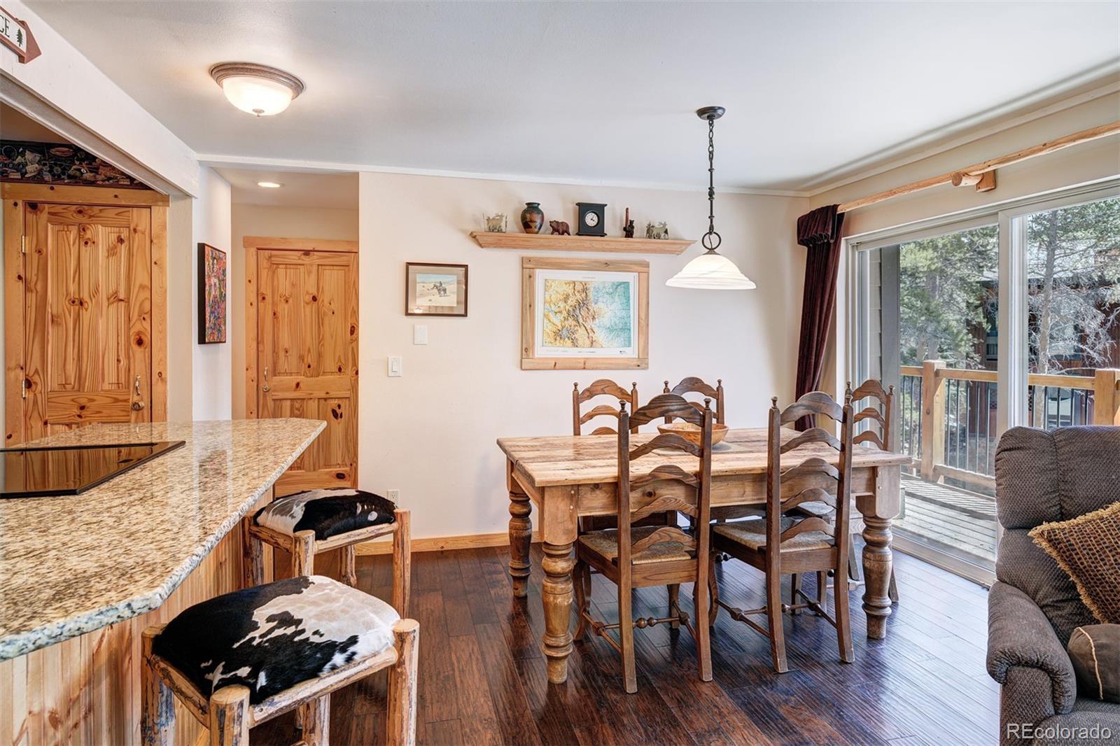 760 Columbine Road, Unit B6 Breckenridge, CO 80424 - Photo 8 of 39 a view of a dining room with furniture window and wooden floor
