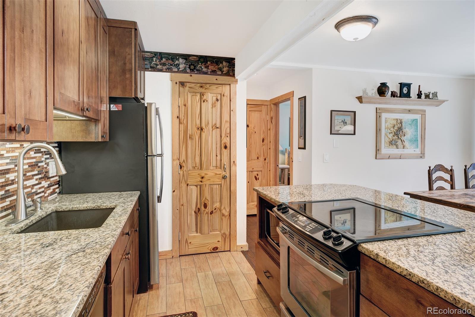 760 Columbine Road, Unit B6 Breckenridge, CO 80424 - Photo 10 of 39 a kitchen that has a sink a stove and oven