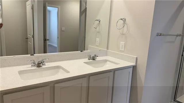 a white toilet sitting next to a white sink