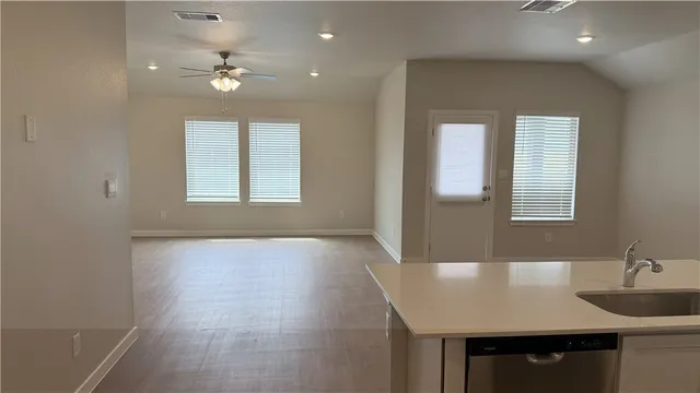 a view of kitchen with wooden floor