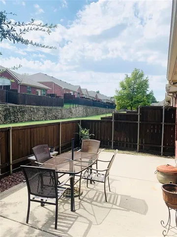 a view of a chairs and table in the terrace
