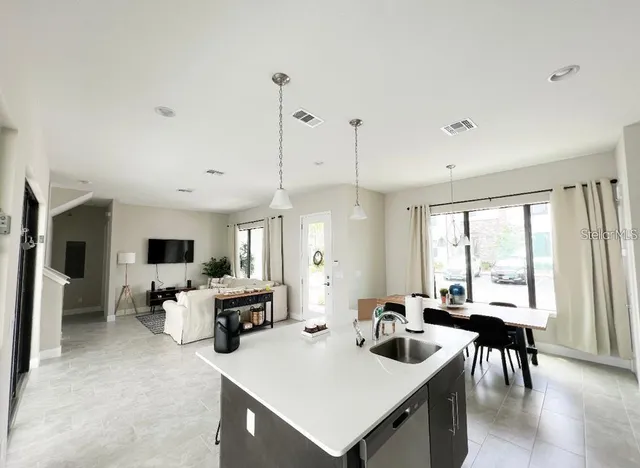 a view of a dining room with furniture window and outside view
