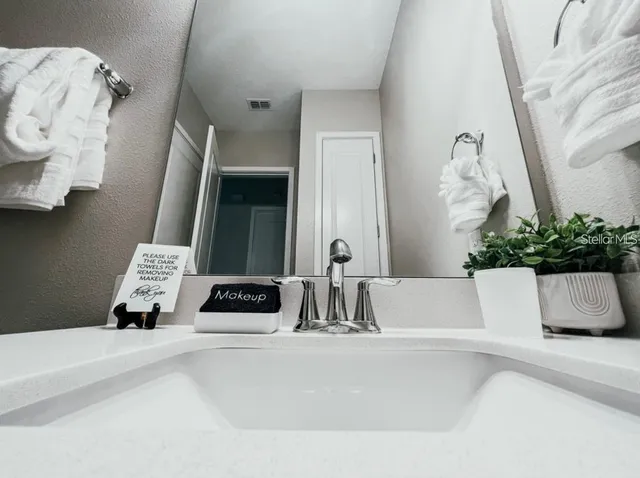 a bathroom with a bathtub and a sink