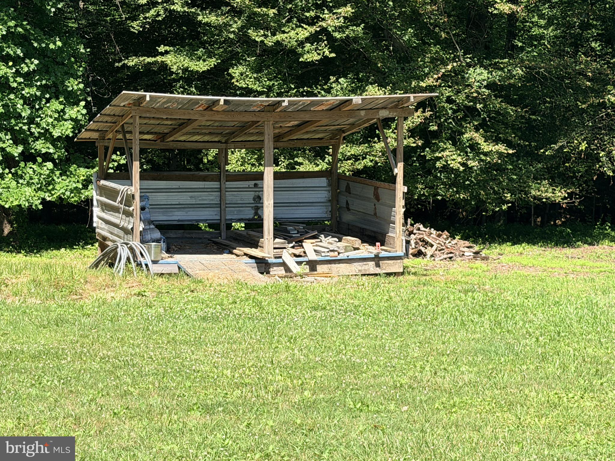 586 Zeitler Road Elkton, MD 21921 - Photo 37 of 55 Rustic shelter amidst lush greenery.