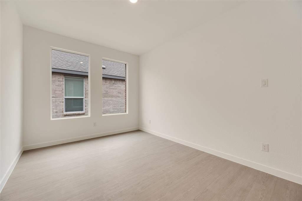 2416 Conroe Road Celina, TX 75009 - Photo 20 of 28 a view of an empty room with a window
