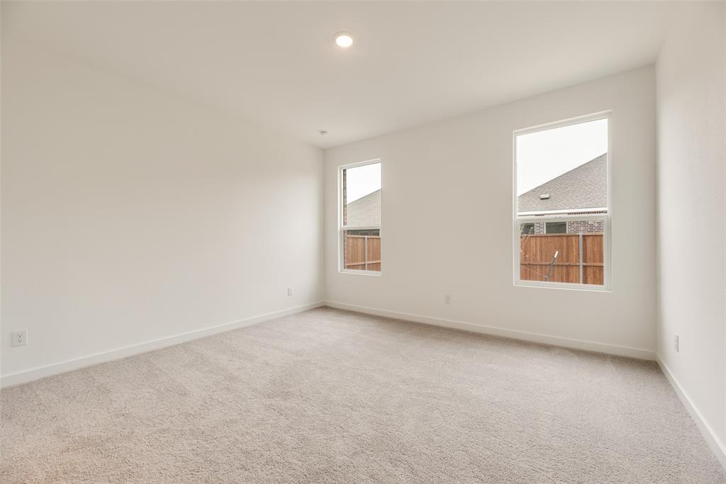 2416 Conroe Road Celina, TX 75009 - Photo 22 of 28 an empty room with a window