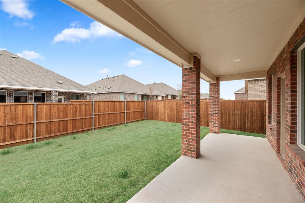 2416 Conroe Road Celina, TX 75009 - Photo 25 of 28 a view of a garden with a small cabin