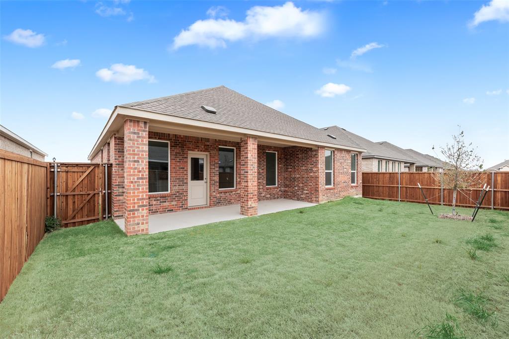 2416 Conroe Road Celina, TX 75009 - Photo 28 of 28 a view of a house with backyard porch and garden