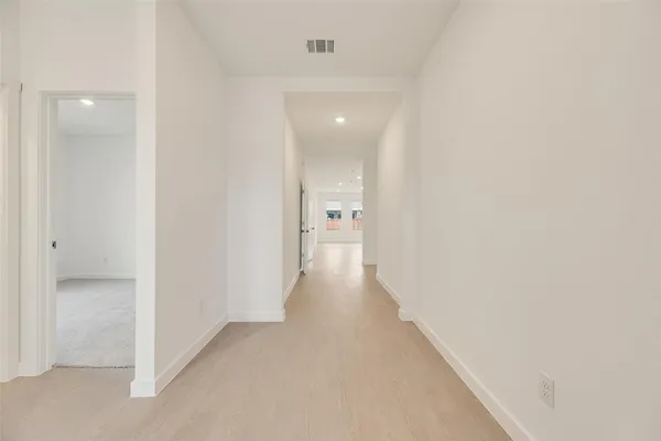 a view of a hallway with a wooden shelves