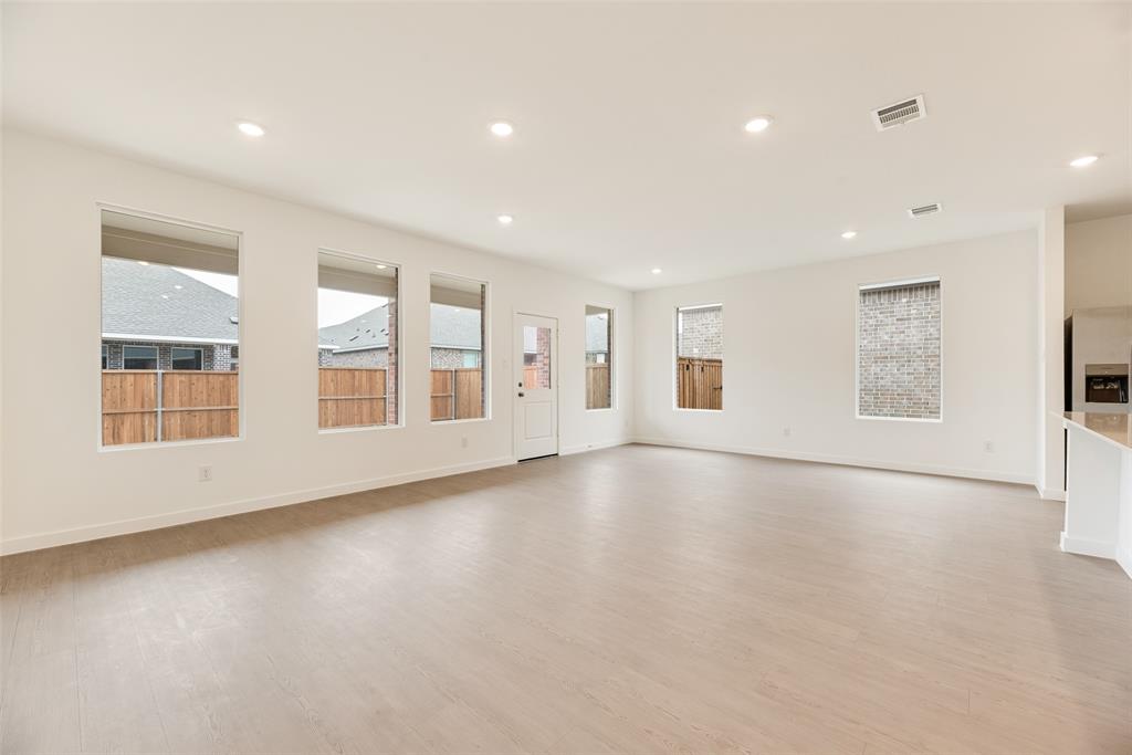 2416 Conroe Road Celina, TX 75009 - Photo 5 of 28 an empty room with windows
