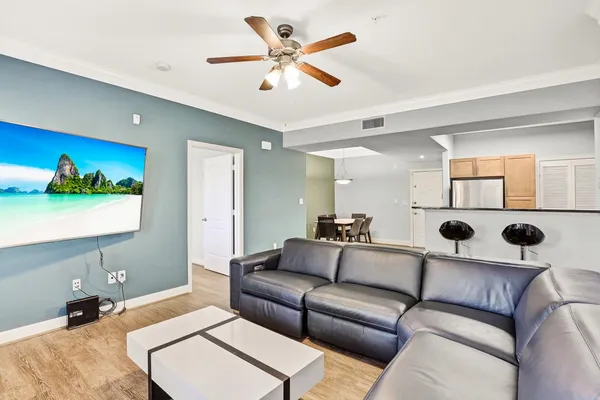 a living room with furniture and a large mirror