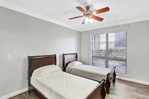 a bedroom with two beds and a table