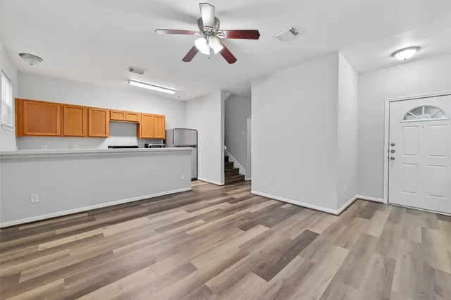 a view of a kitchen with microwave and cabinets