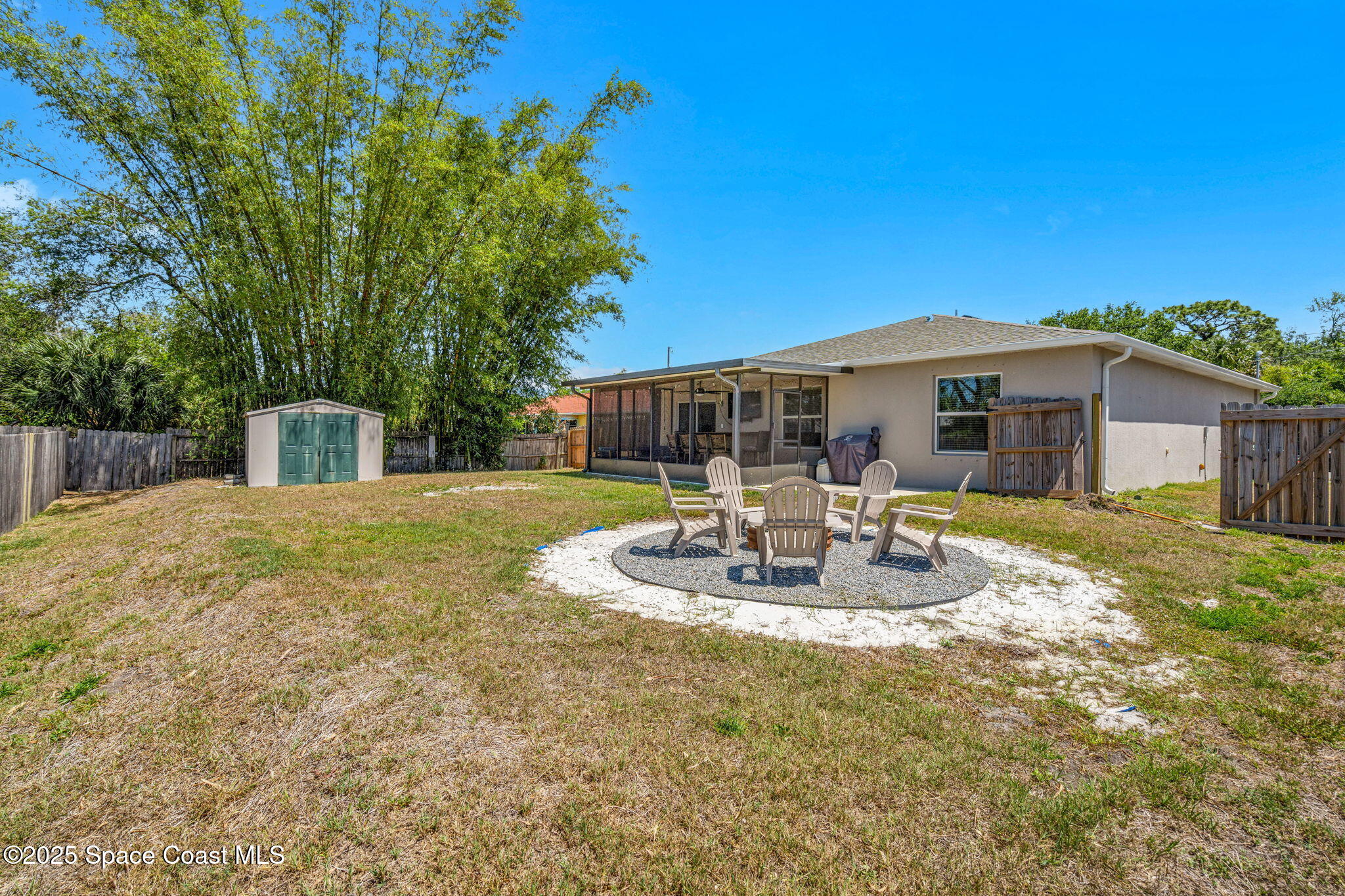 6162 Rena Avenue Cocoa, FL 32927 - Photo 30 of 42 a view of a house with backyard and sitting area