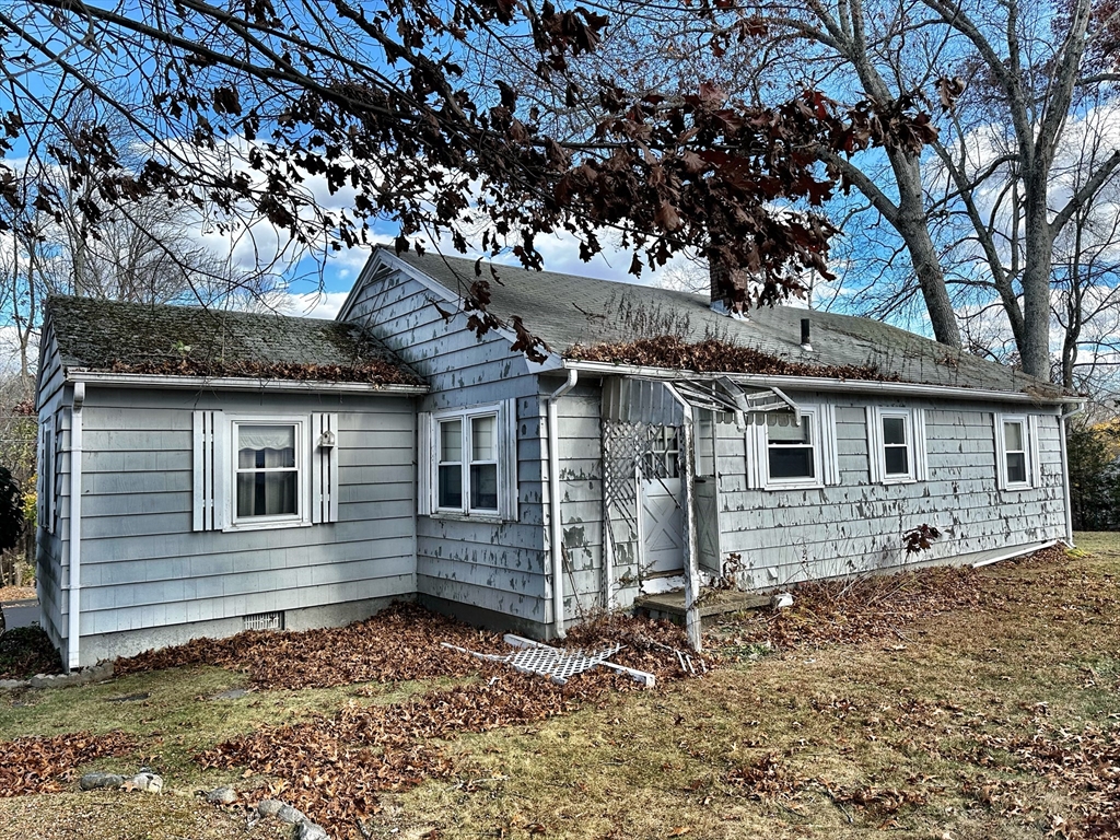 30 Maple Street Hudson, MA 01749 - Photo 6 of 9 a view of a house with a yard