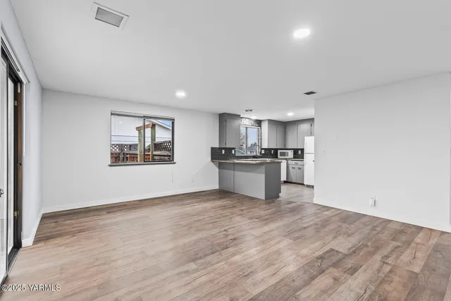 a view of kitchen with wooden floor
