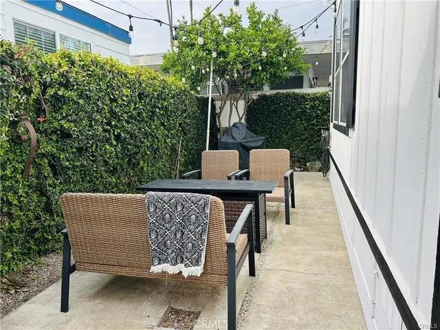 a view of balcony with furniture and outdoor